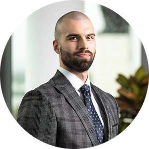 Core team member Martin Herczeg smiling in a professional setting with a neutral background